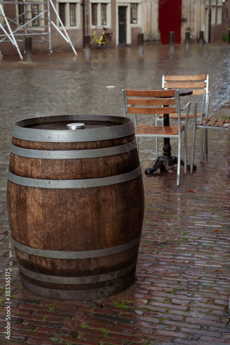 Wooden table and barrel after the heavy rain in Leiden, Netherlands