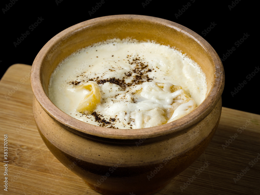 Dumplings in a pot, cooked in Russian, in the oven. Dumplings in a pot, cooked in Russian, in the oven.