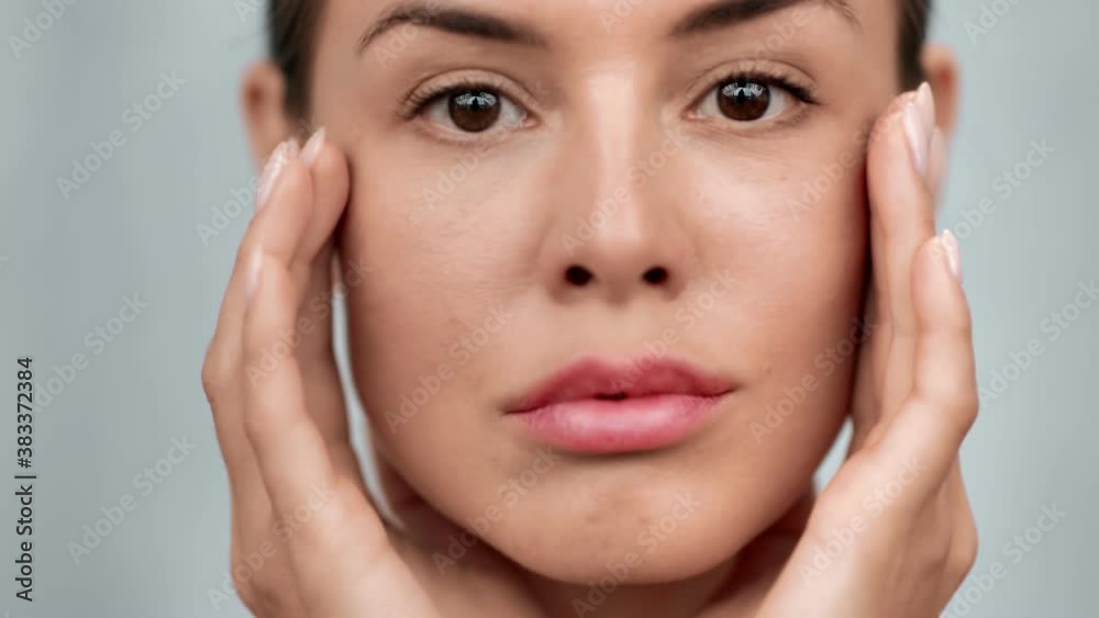 Closeup female model with perfect skin applying moisturizing cream isolated. 4k Dragon RED camera Closeup female model with perfect skin applying moisturizing cream isolated. 4k Dragon RED camera