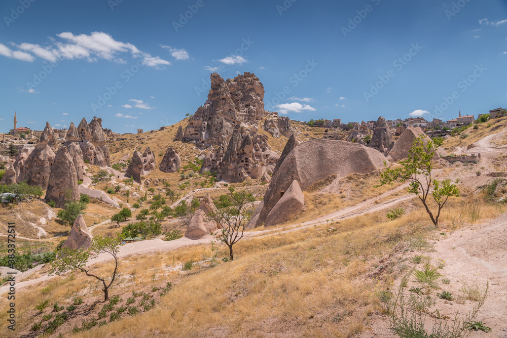Scenic view of Uchisar castle with rock formations caves and rock buildings