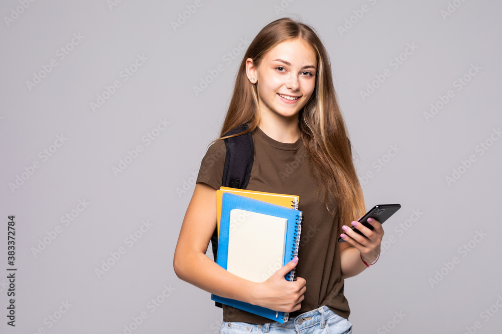 Happy smiling woman student use the phone isolated on white background Happy smiling woman student use the phone isolated on white background
