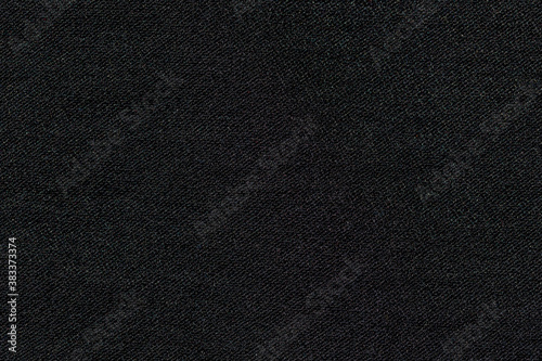 Abstract black synthetic fabric texture and background. Detail of canvas textile material.