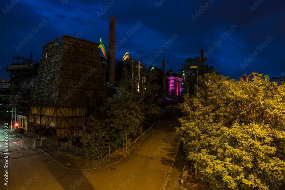 historic steelworks at night