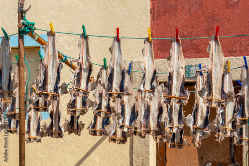 Fish drying on a street. Peniche. Portugal photo