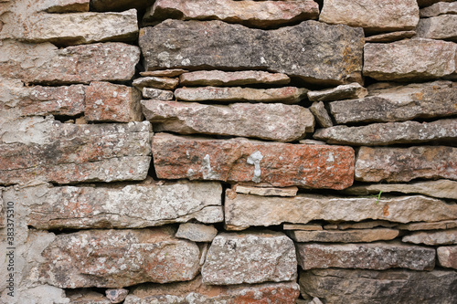 Old stone wall texture background. The stone wall texture background natural color.