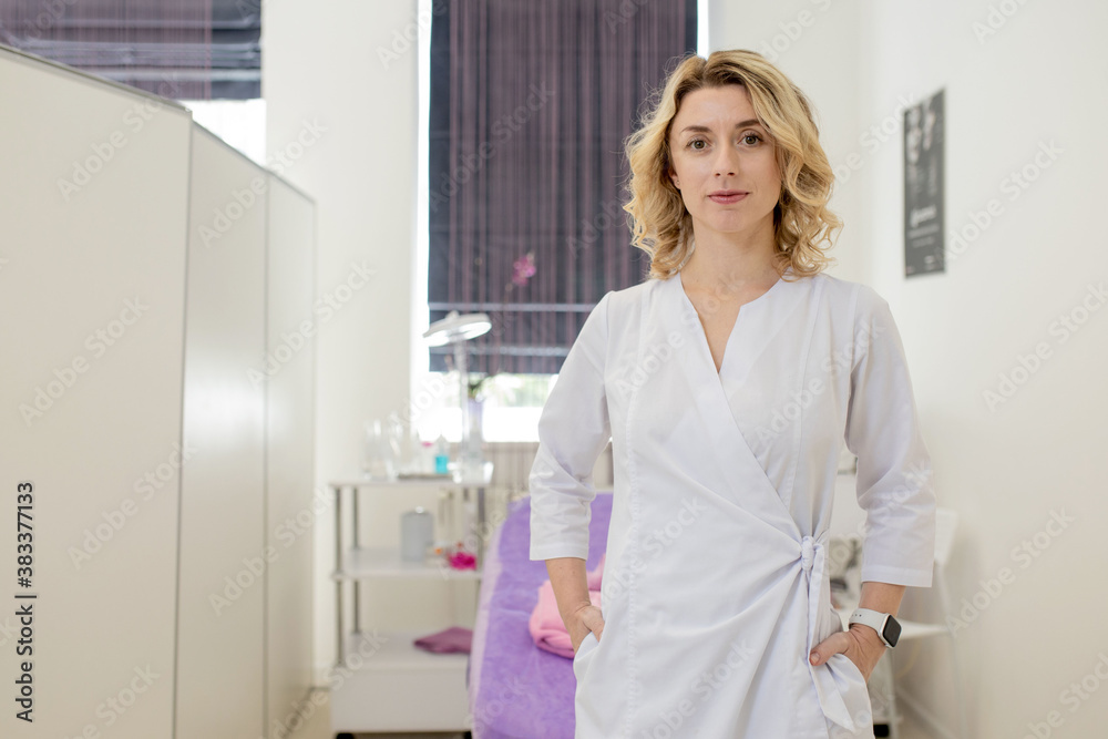 Cosmetologist, portrait of a beautician doctor on the background of the office Cosmetologist, portrait of a beautician doctor on the background of the office