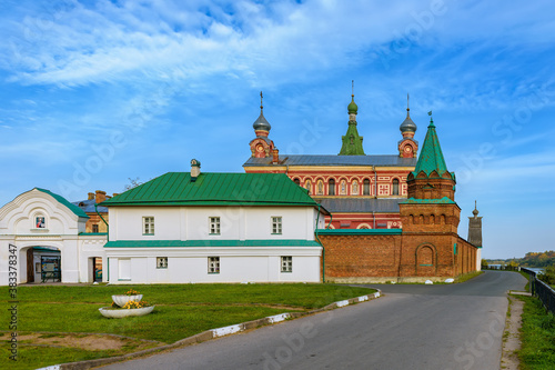 Fortified walls surrounding of Staraya Ladoga Saint Nicholas (Staroladozhsky Nikolsky) male monastery on the banks of the Volkhov river at sunny autumn day
