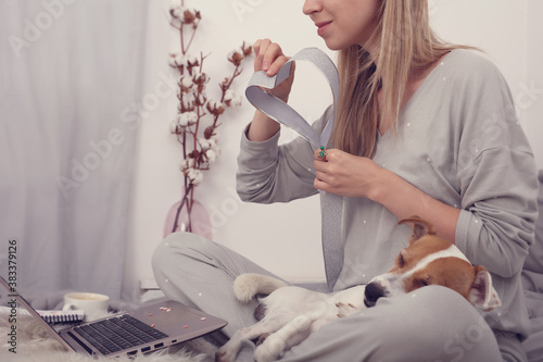 DIY Craft Project and for New, Year, Christmas or Birthdays. Cozy style weared woman watching how-to guide on laptop