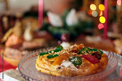 Portuguese traditional Christmas cake called Bolo rei or King's Cake on christmas table