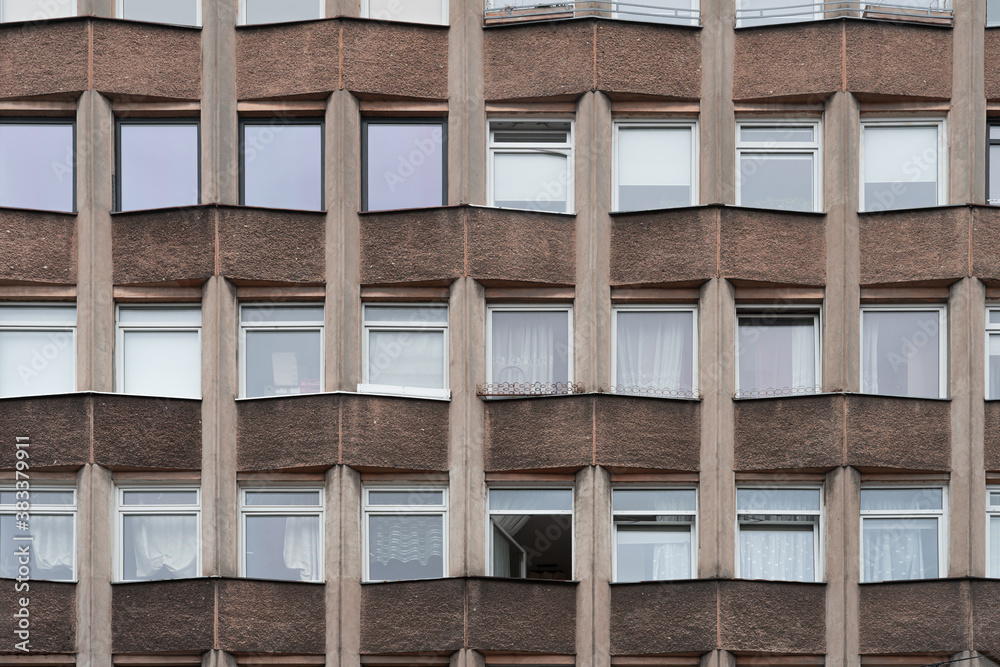 Old residential building facade with one window open. Architectural background Old residential building facade with one window open. Architectural background