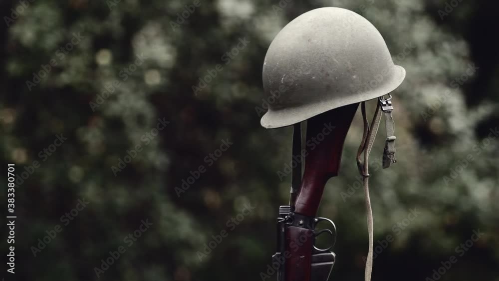 World War era M1 helmet and rifle
