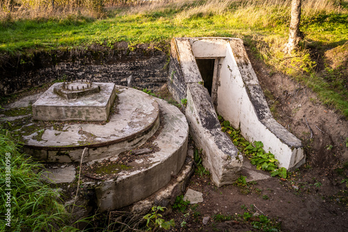 Grey horse Fort. The entrance to the defenses of battery 332 and the preserved carriage for Vickers guns. © yurisuslov