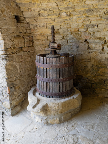 old wine press used to crush the bunches of grapes