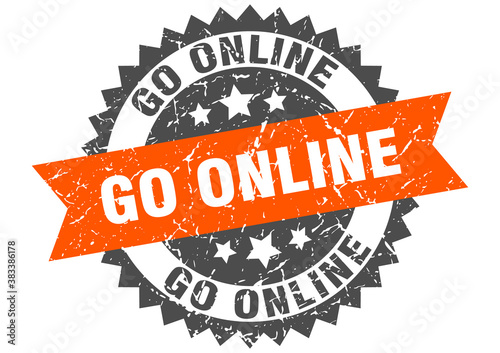 go online stamp. grunge round sign with ribbon