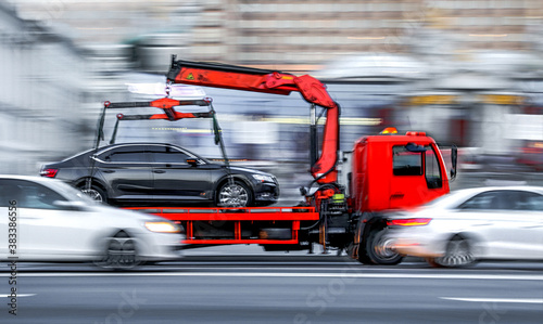 tow truck delivers the damaged vehicle © bluraz