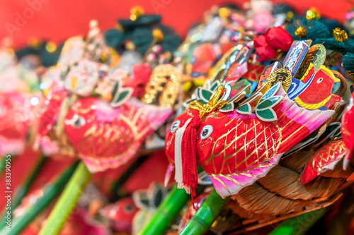 Obraz na plátně Auspicious rake or kisshō kumade ornated with Japanese folklore lucky charms like the sea bream and red snapper of Ebisu god of fishing or gold koban coins