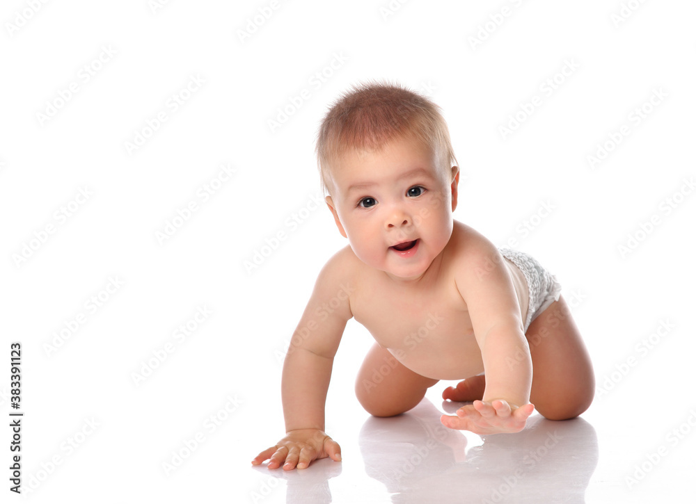 Adorable baby sitting and looking aside over white background Adorable baby sitting and looking aside over white background