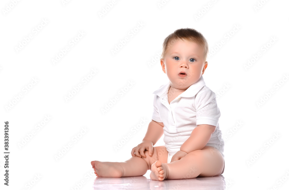 One baby boy with funny cute expression isolated on white. One baby boy with funny cute expression isolated on white.