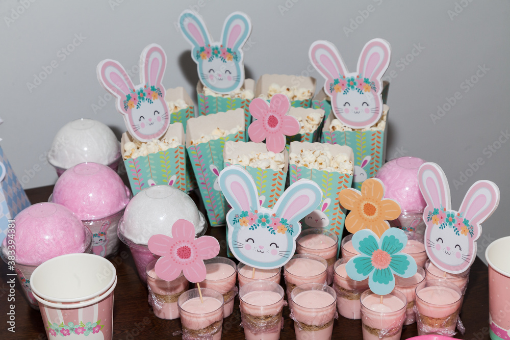 Thematic decoration for parties; Baby Shower - Table decorated with: Cakes, sweets, paper rabbits. Thematic decoration for parties; Baby Shower - Table decorated with: Cakes, sweets, paper rabbits.