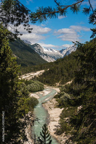 View of the Isar River close to Scharnitz village, austrian Alps, during the summer