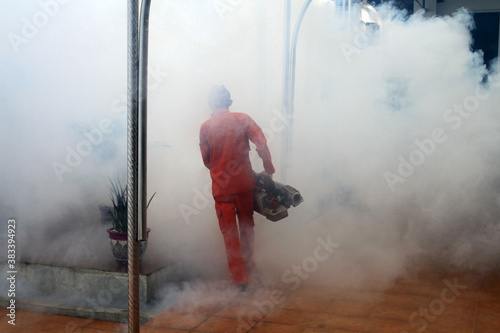 Pekanbaru City Health Services Officer. Do fogging to prevent dengue mosquitoes.