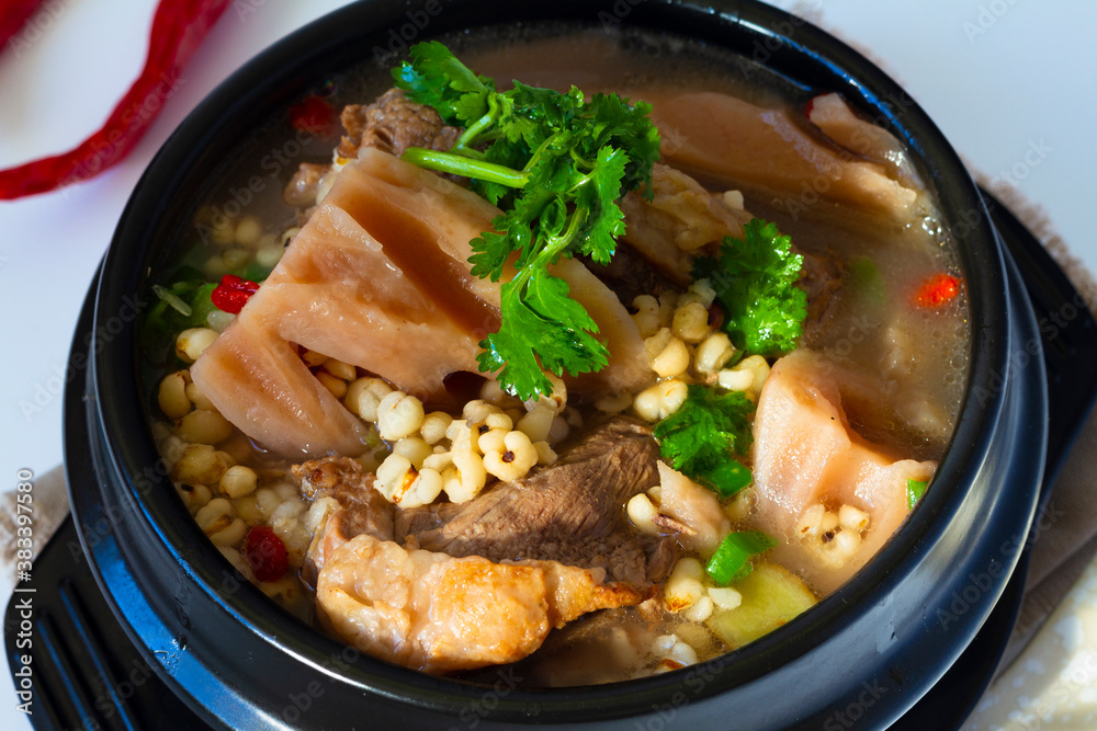 Chinese Food: pork bone and lotus root soup skew in a bowl