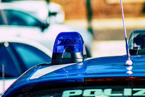 Closeup of an official police car patrolling the streets of the city center of the metropolitan area
