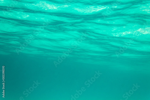 view of the waves from under the water, the azure sea