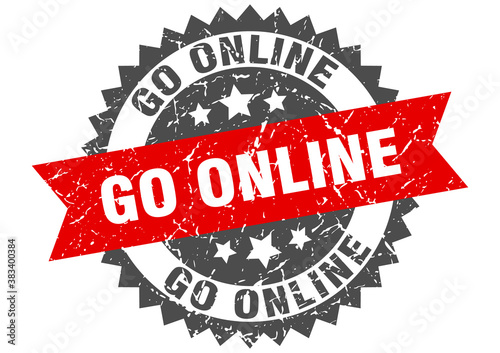 go online stamp. grunge round sign with ribbon