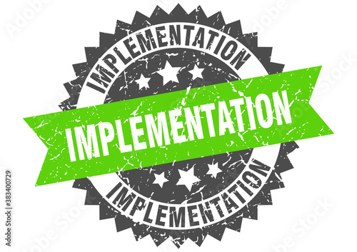 implementation stamp. grunge round sign with ribbon