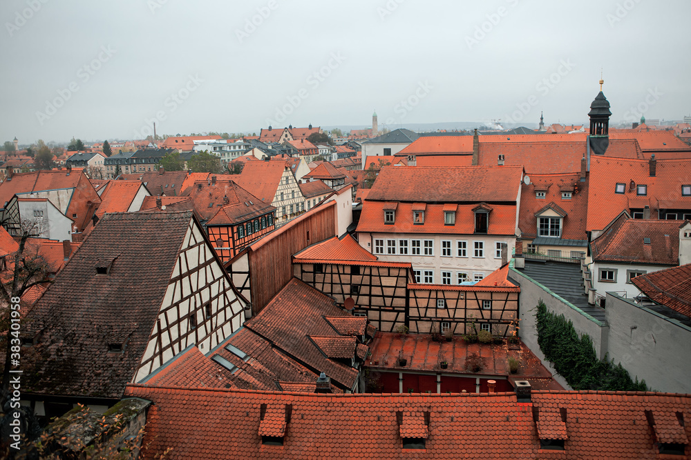 Looking overhead onto red rooftops and houses of old town