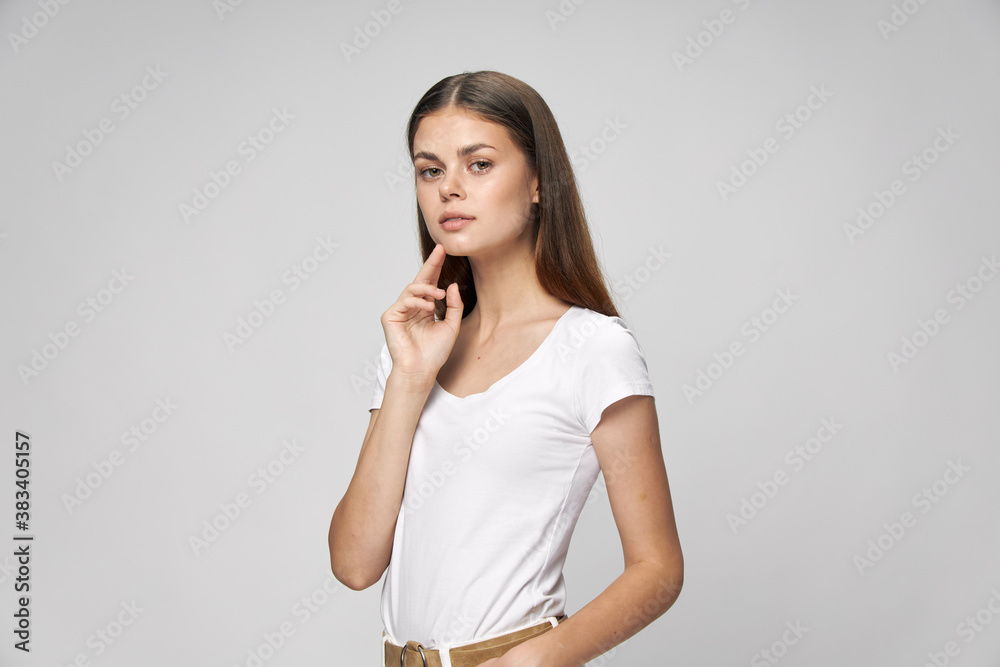 Woman in white t-shirt in manual face look forward cropped view Woman in white t-shirt in manual face look forward cropped view