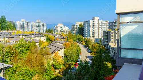 Early autumn colours at a Burnaby Mountain, BC, residential community with North Shore mountain backdrop