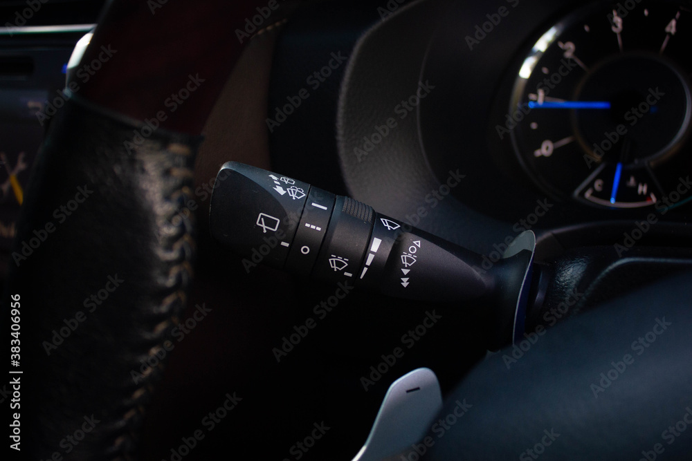 Windscreen wiper control switch in car. Wipers control. Modern car