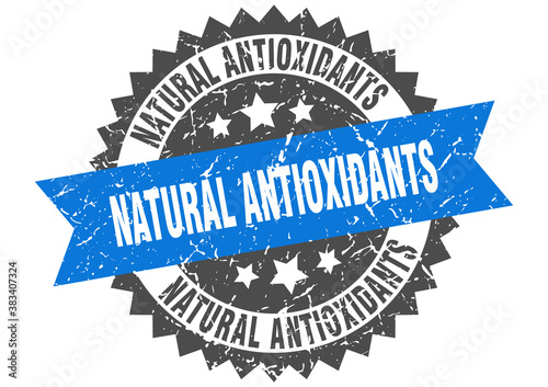 natural antioxidants stamp. grunge round sign with ribbon