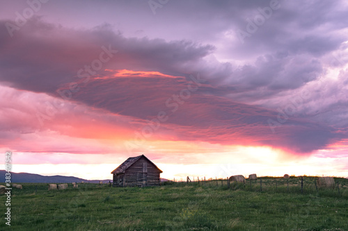 Sunset over farm building