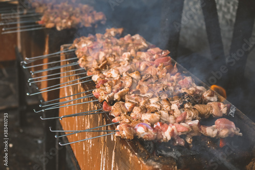 Sate Klatak grilling on charcoal grill. Sate klathak is a unique goat satay or mutton satay dish, originally from Yogyakarta, Indonesia. photo