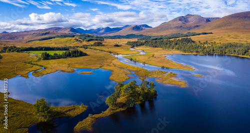 aerial drone image of loch tulla in the argyll region of the highlands of scotland during autumn on a clear bright day showing calm waters on the inland loch © Andy Morehouse