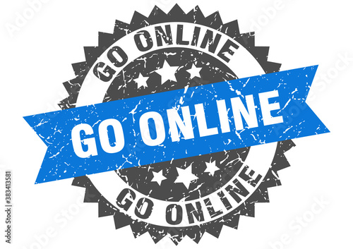 go online stamp. grunge round sign with ribbon