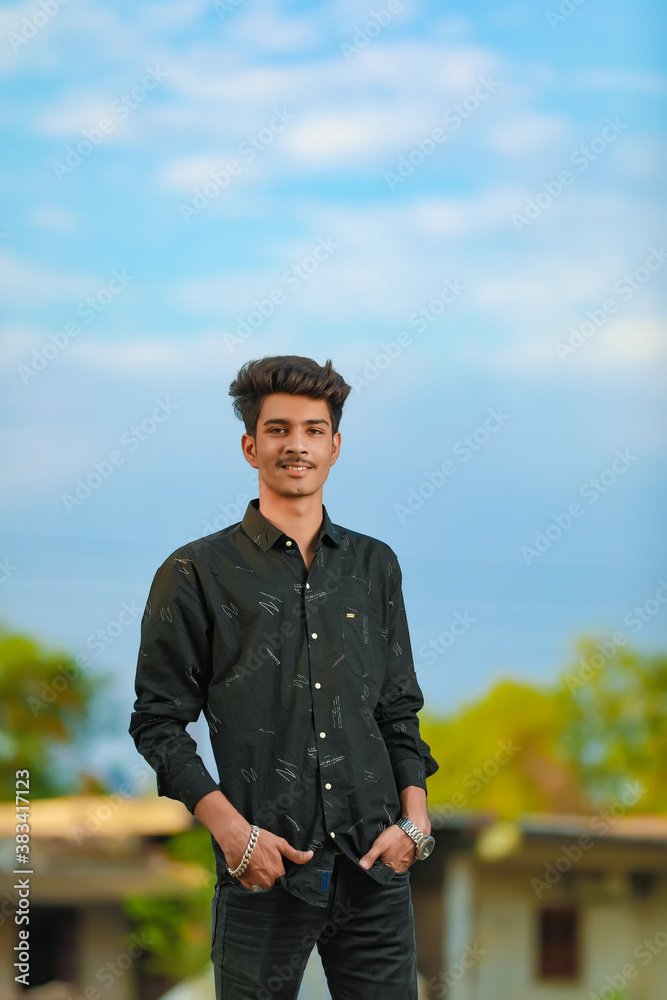 Young handsome indian man wearing black shirt