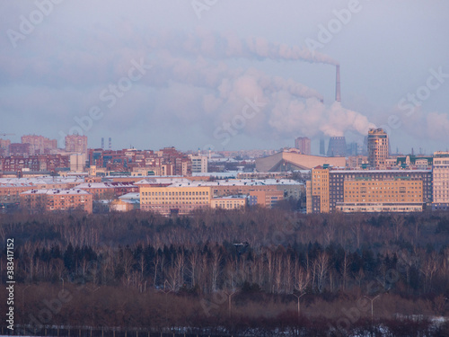 Fuming powerful CHPP-5 in severe frost over the SKK them. Blinova. View from the other side of the Irtysh