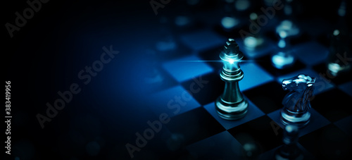 Chess board game to represent the business strategy with competition and challenging concept photo