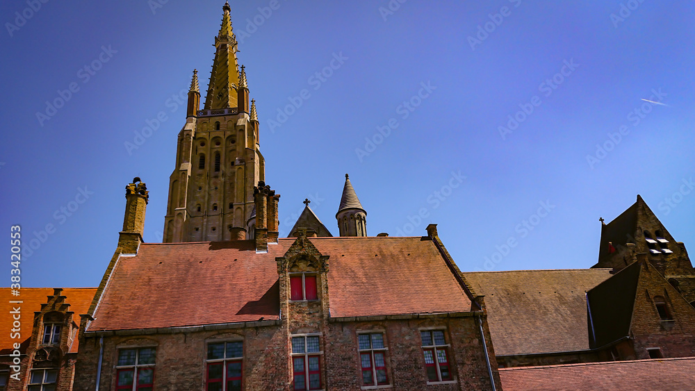 Roofs And Windows Of Old Brick Houses In Bruges, Belgium.