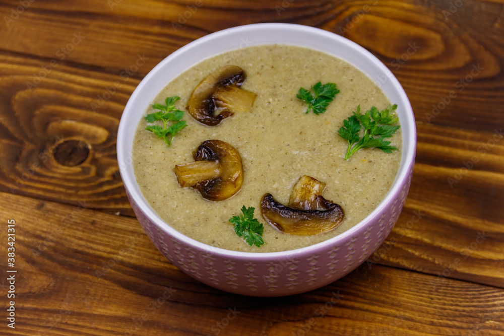 Mushroom cream soup on a wooden table Mushroom cream soup on a wooden table