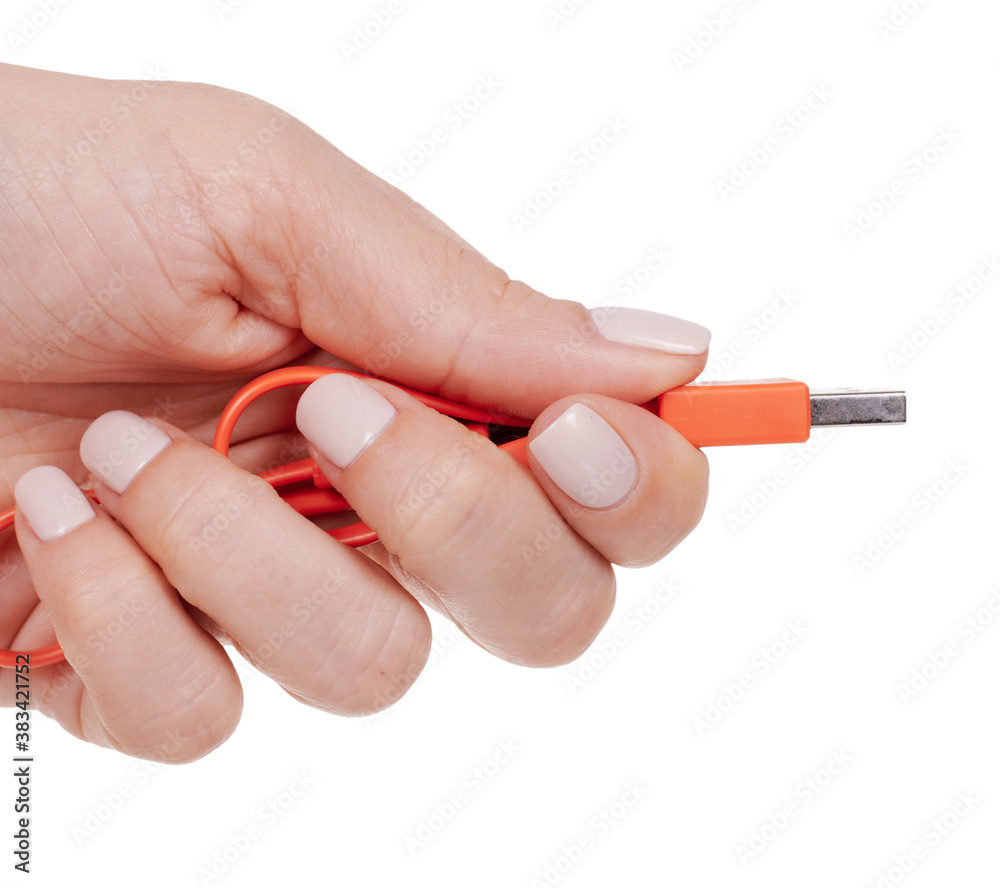 Hand with USB cable, connection wire. Isolated on white background. Hand with USB cable, connection wire. Isolated on white background.