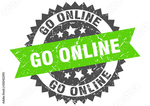 go online stamp. grunge round sign with ribbon