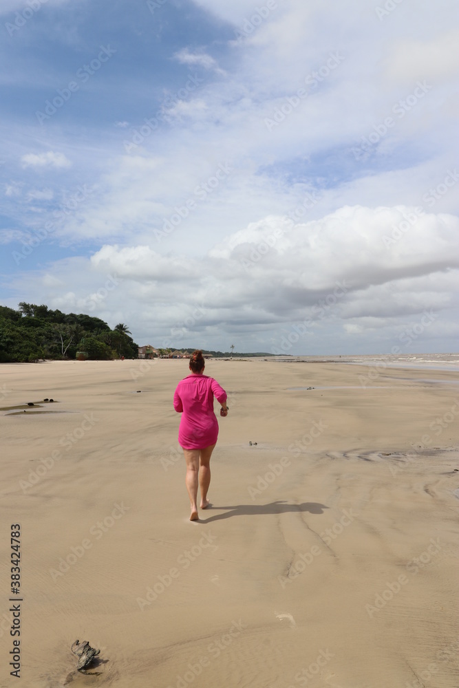 child running on the beach