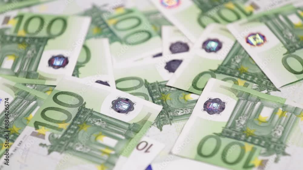 Hundred euro cash bills go round and round. Euro money close up Hundred euro cash bills go round and round. Euro money close up