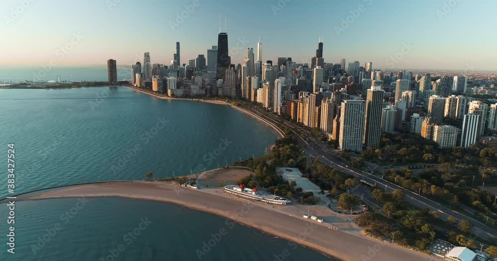 High angle aerial above city beach in Chicago downtown. Clear sky with sunrise light High angle aerial above city beach in Chicago downtown. Clear sky with sunrise light