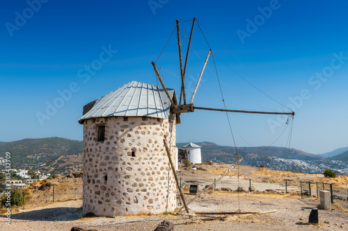 Old windmill in autumn sunny day, Bodrum, Turkey. 